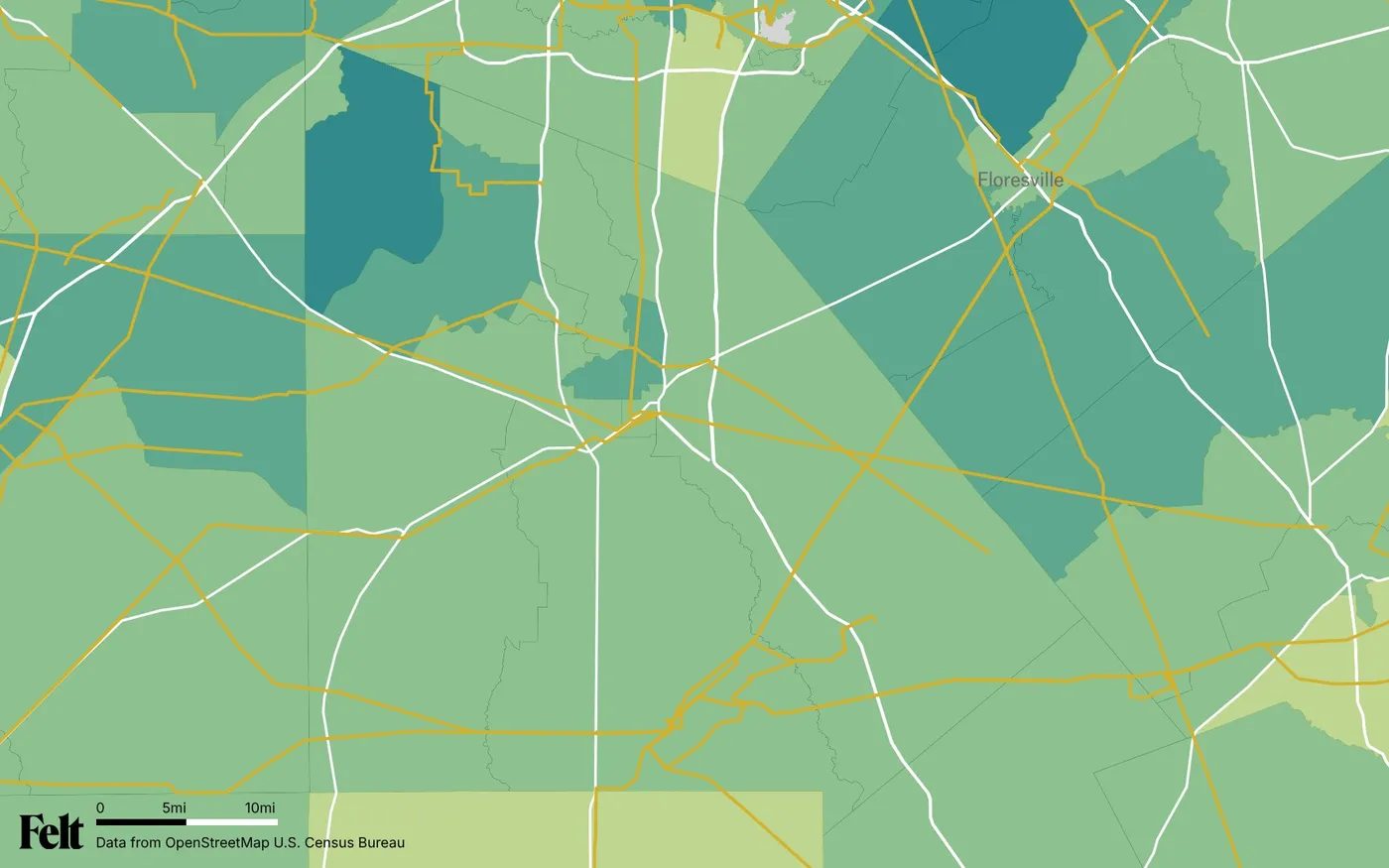 Map of Atascosa County, Texas: the county outlined, with transmission lines over median household income by census tract