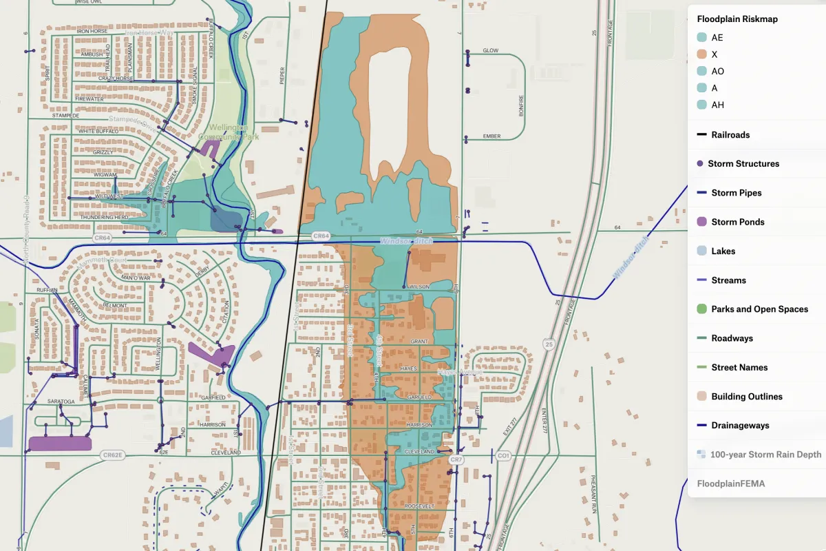 A Felt map of FEMA floodplain zones over a neighborhood, with storm pipes, drainageways and building outlines