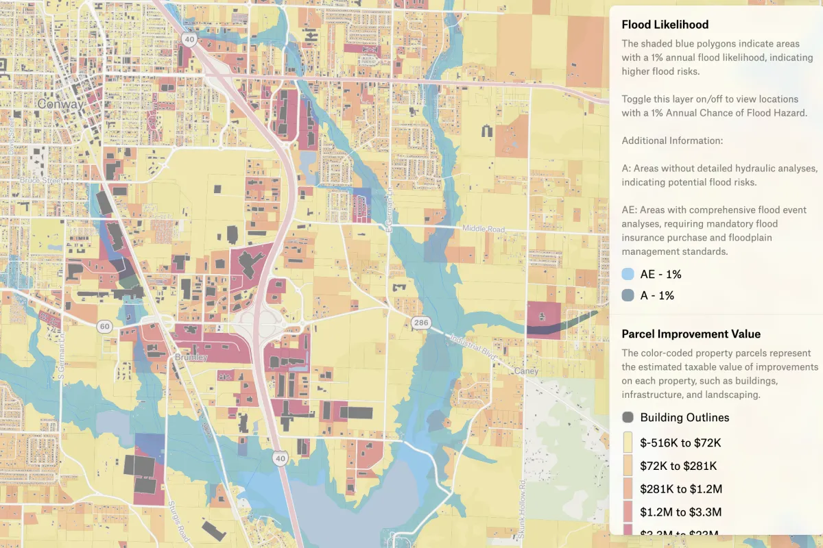 A Felt map of Conway, Arkansas, with parcels shaded by taxable improvement value and flood zones in blue