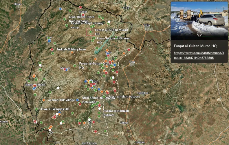 A Felt map of the Afrin region on satellite imagery with colored markers for military sites and IDP camps