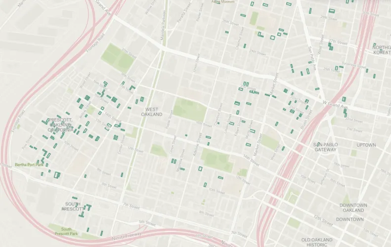 A Felt map of West Oakland with investor-owned property parcels outlined in green