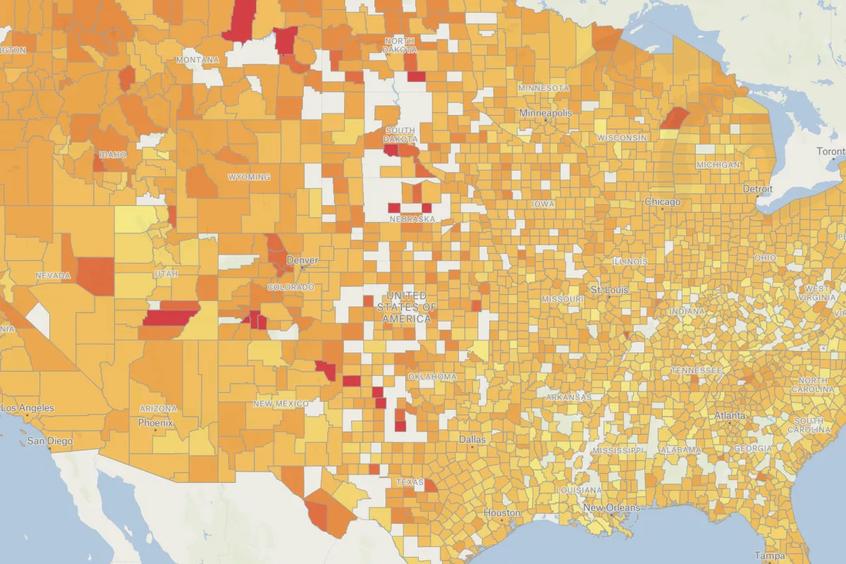 A choropleth map of US counties shaded from yellow to red by coffee shops per capita