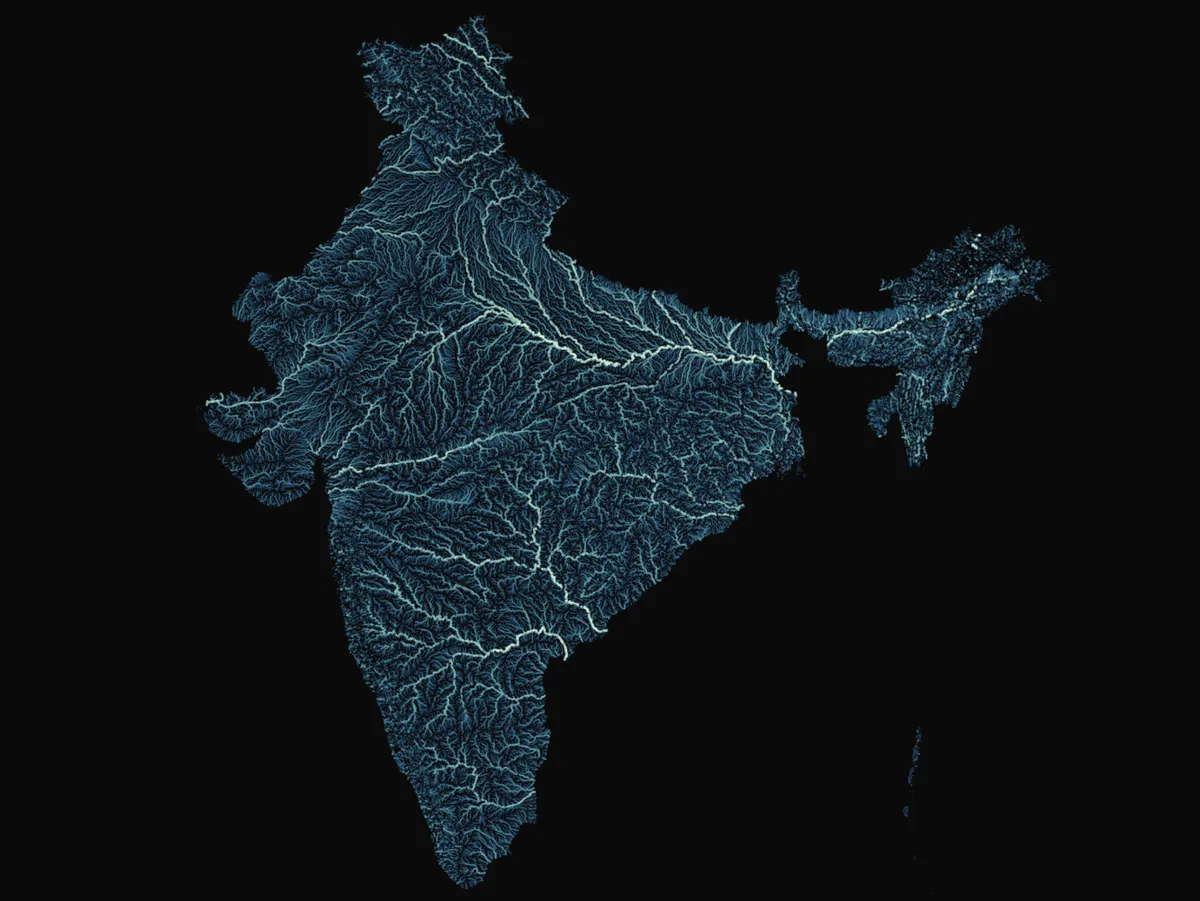 A map of India on a black background with its river network drawn in glowing blue lines