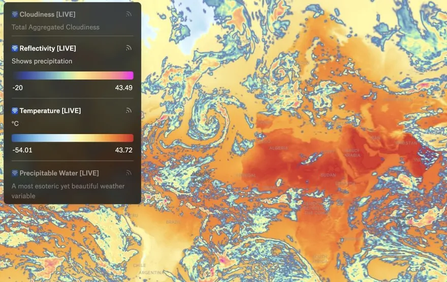 A live global weather map from NOAA data, with cloudiness, reflectivity, temperature, and precipitable water layers in the legend